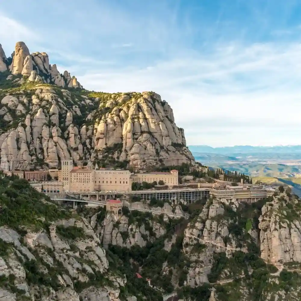 A breathtaking view of Montserrat’s rugged mountains at sunset.