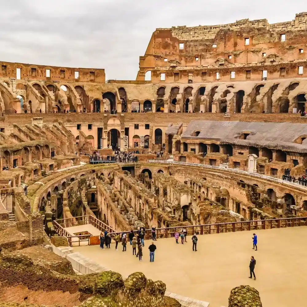 Colosseum in Rome at sunset, iconic ancient amphitheater.