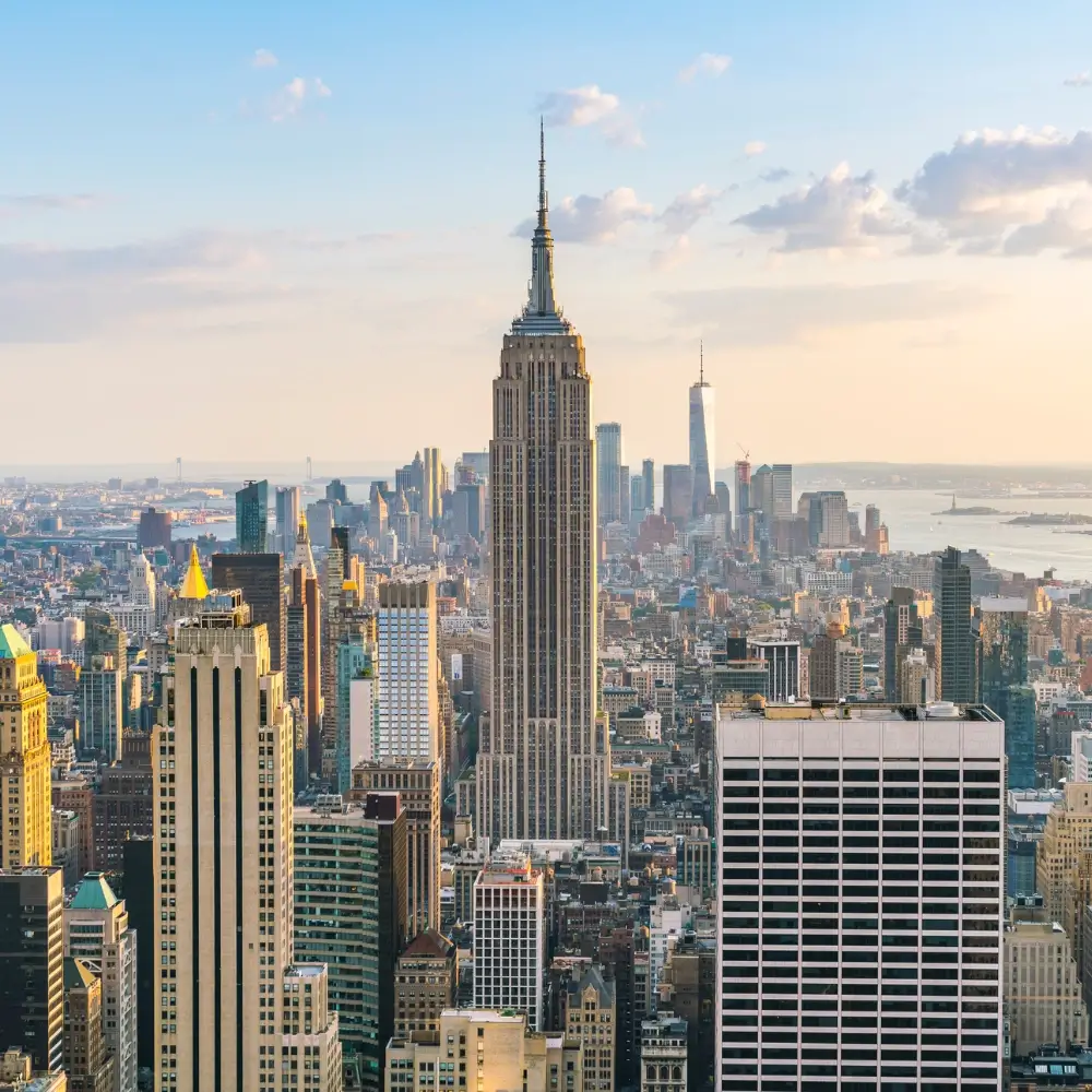 day trips from nyc : Aerial view of New York City skyline at sunset.